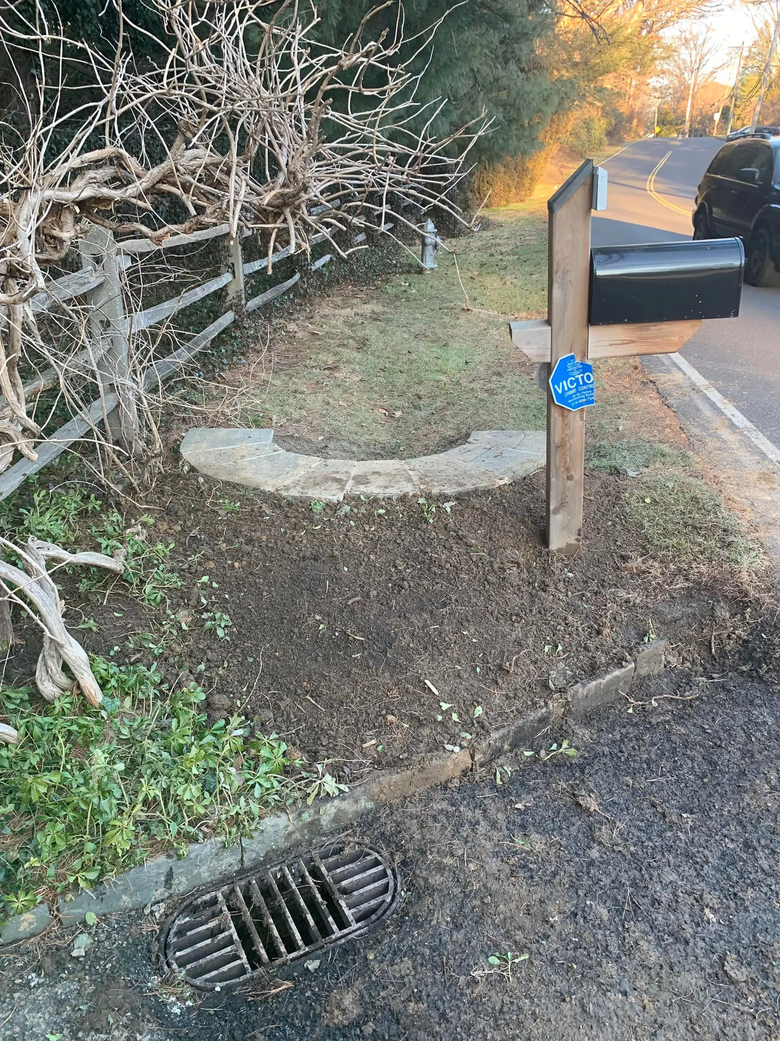A mailbox is sitting on the side of a road.