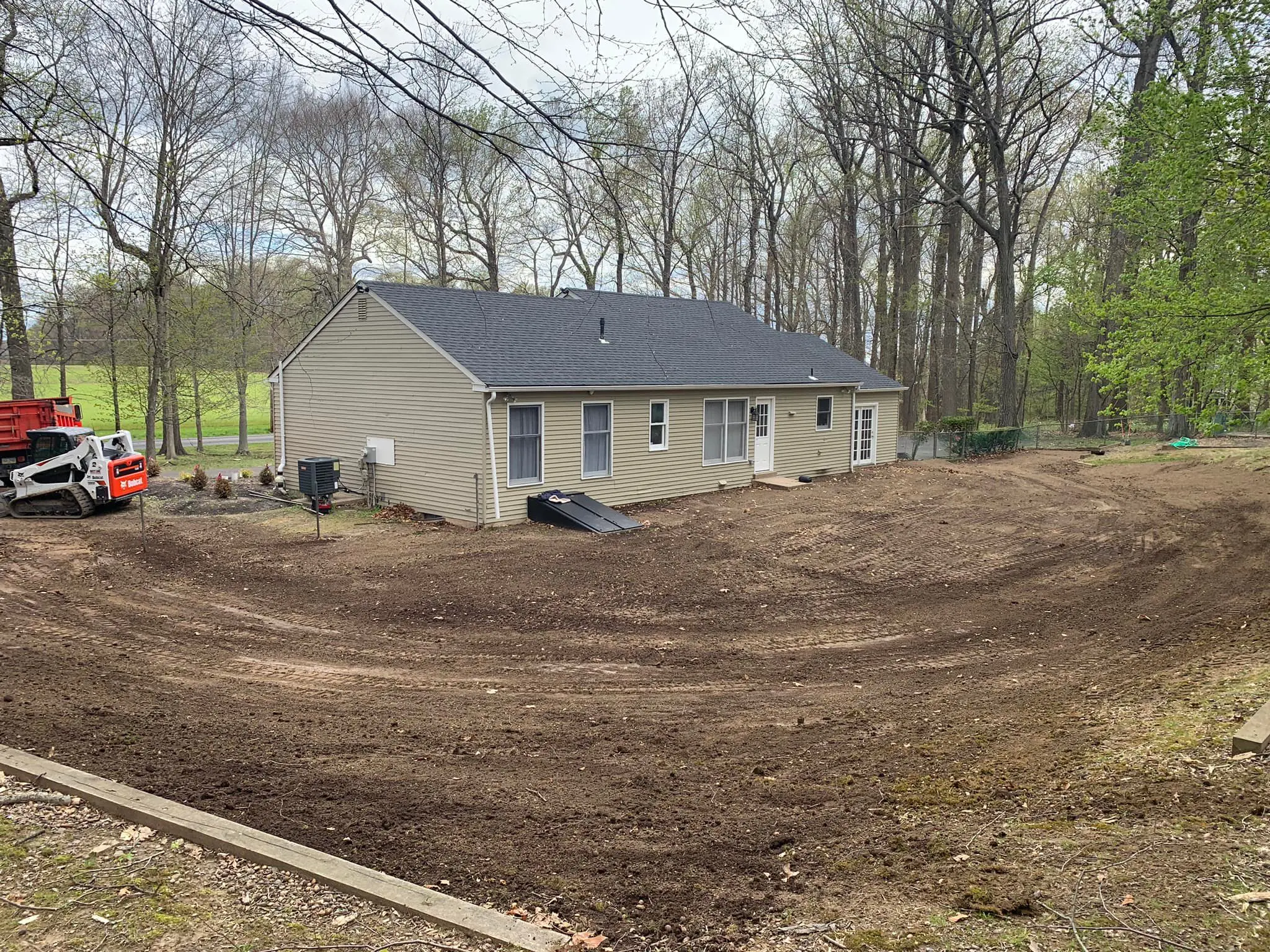 A house that is being built in the dirt.