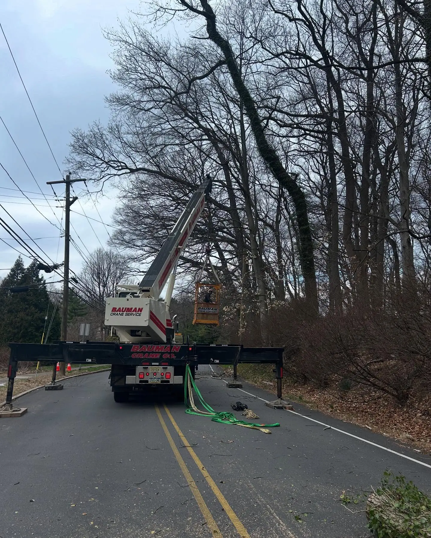 A crane is on the side of the road.