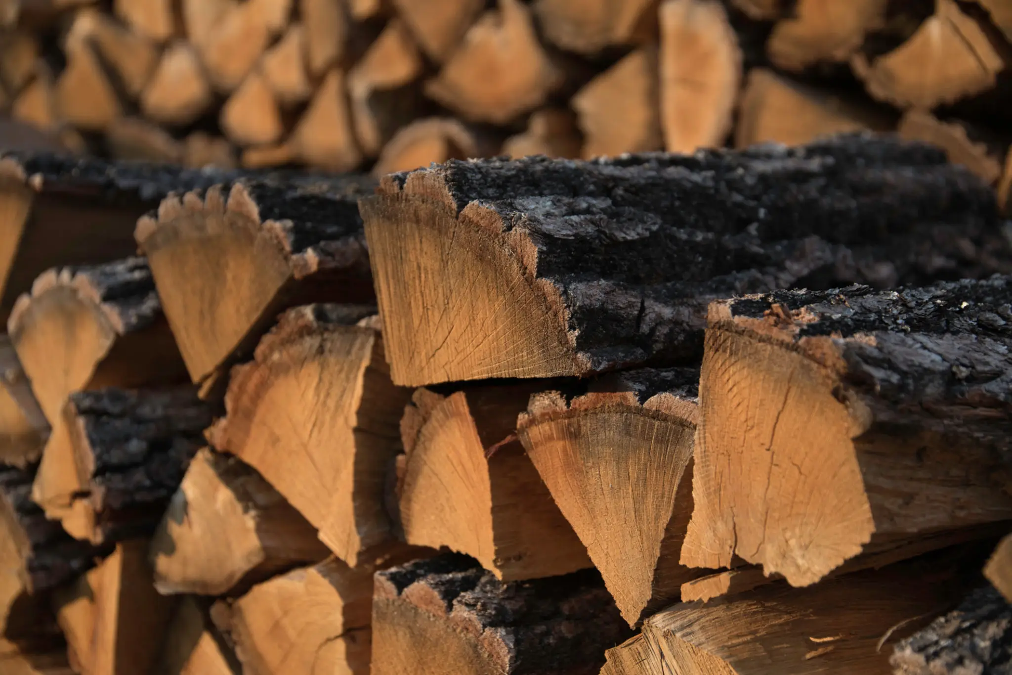 A pile of wood that is stacked on top of each other.